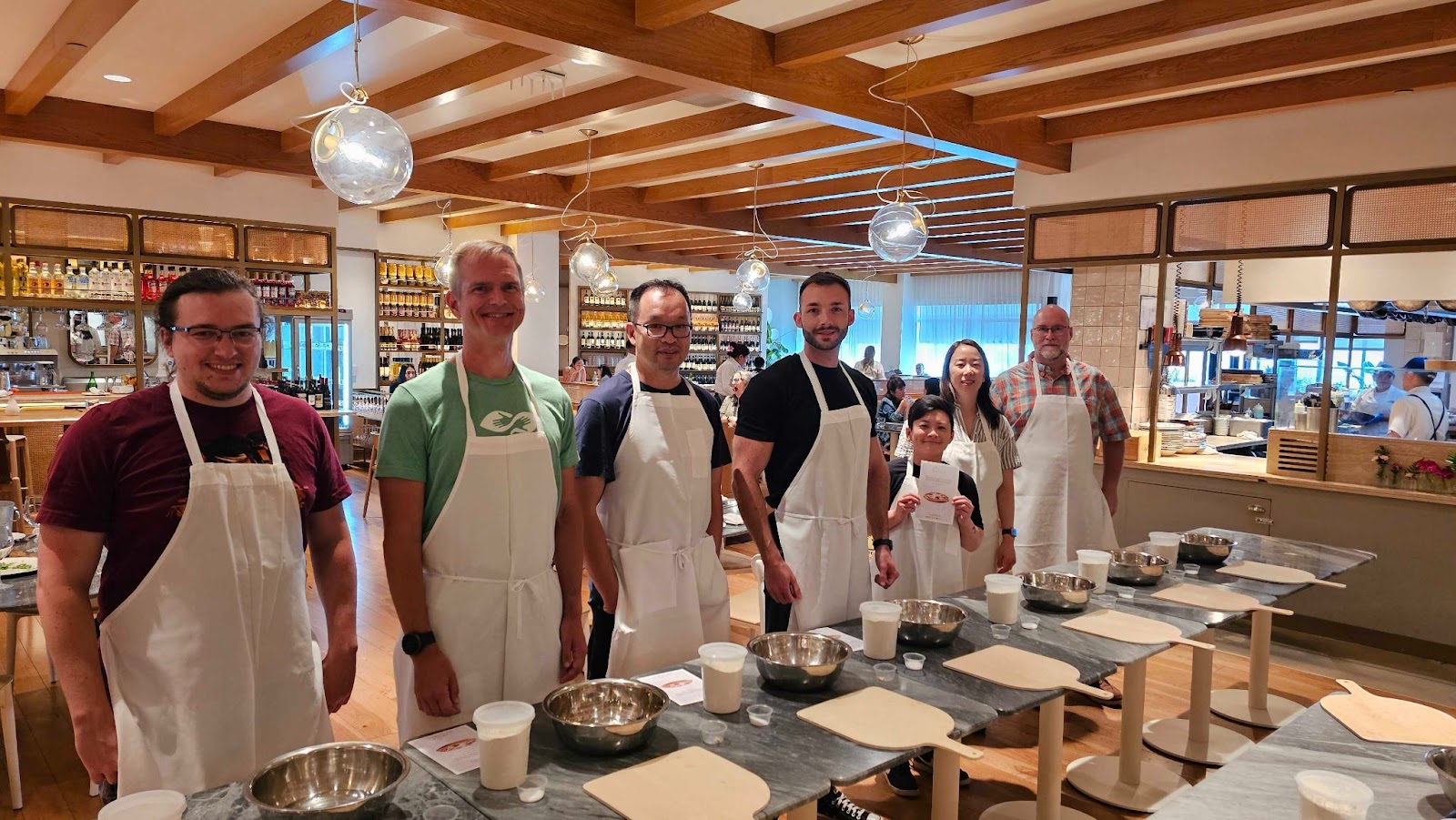 betterhelpers at a cooking class at our work-onsite week
